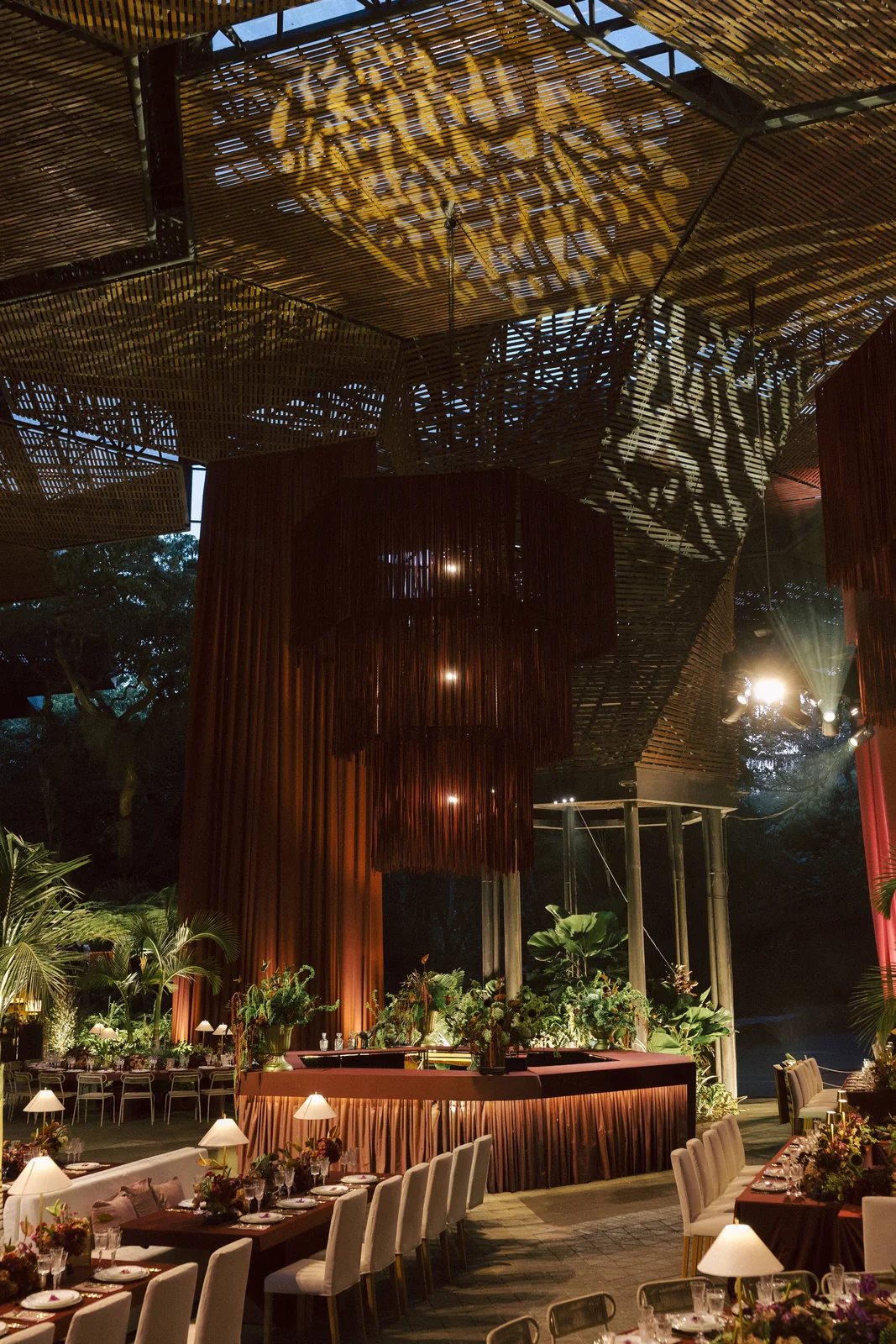 Tables under the drapes at the Orquideorama