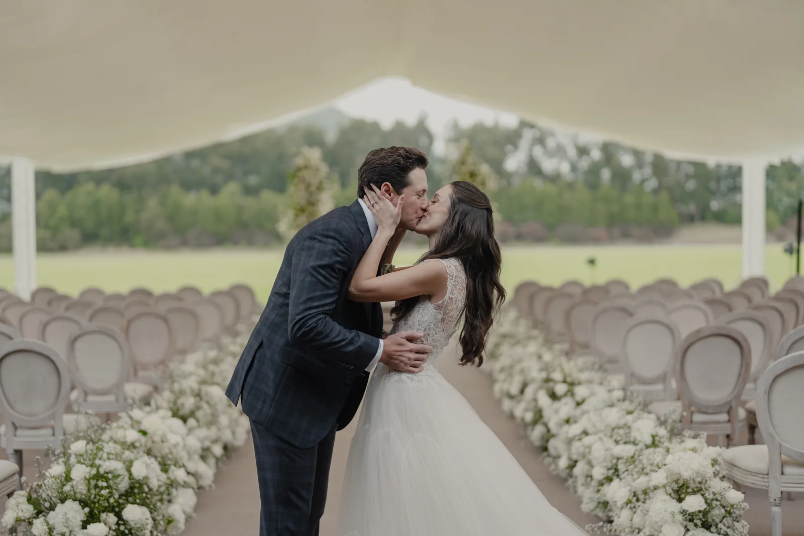Couple kissing among flowers