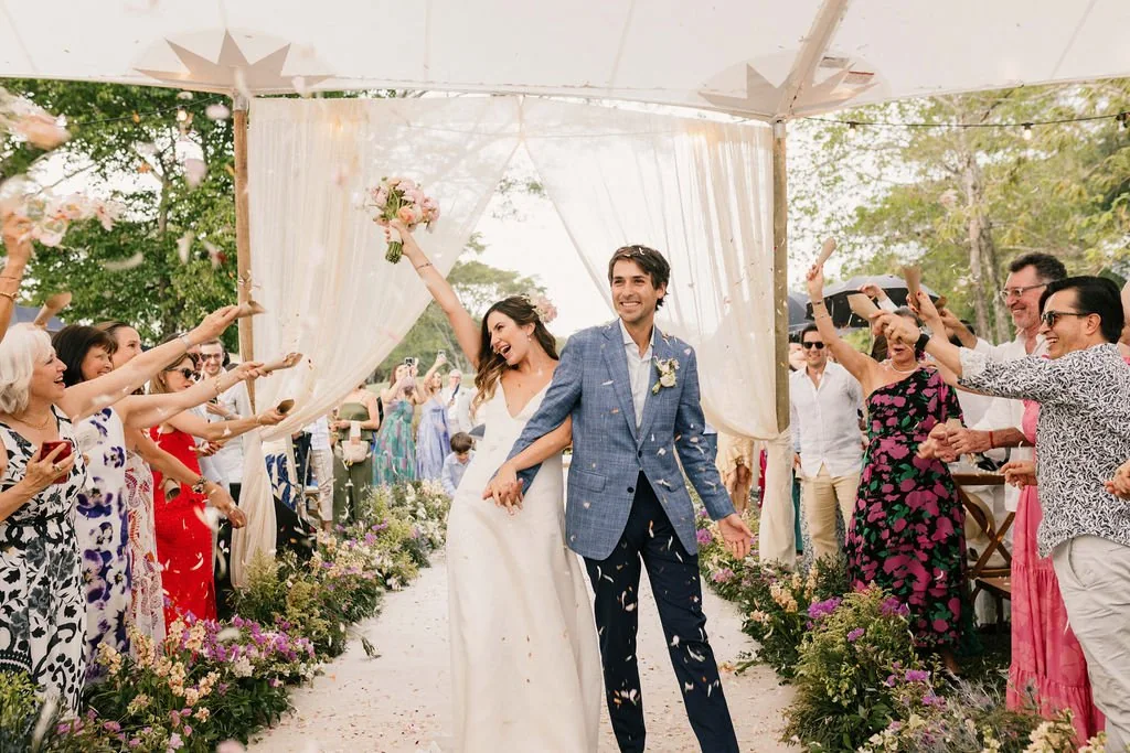 Couple leaving among petals